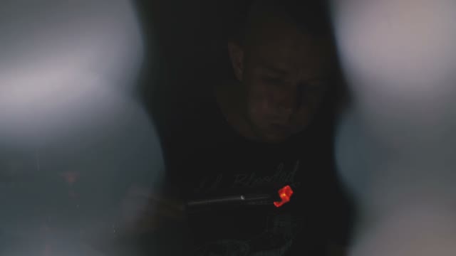 Man Prepares Coal For A Hookah Close-up