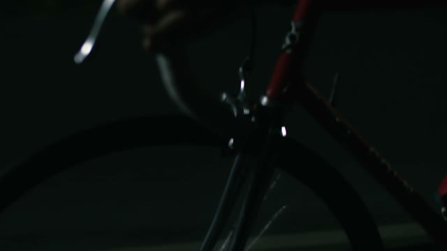Cyclist Riding At Night Close-up