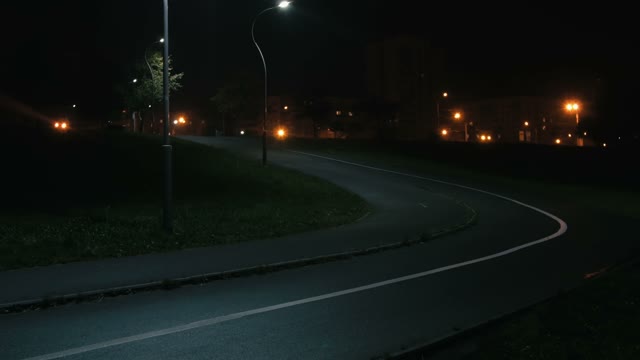 Cyclist Rides Through The Park