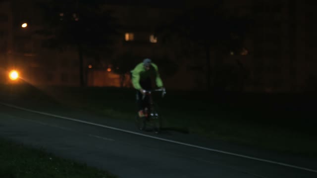 Cyclist Rides Through The Park