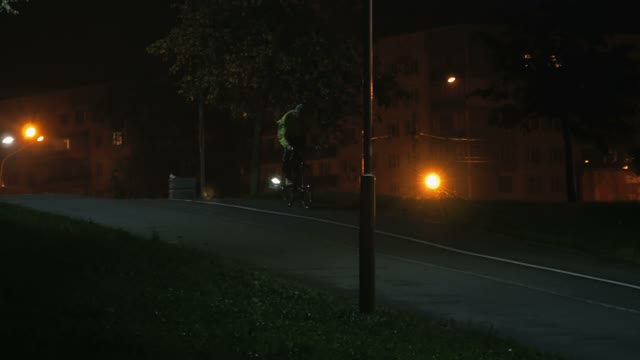 Cyclist Rides Through The Park