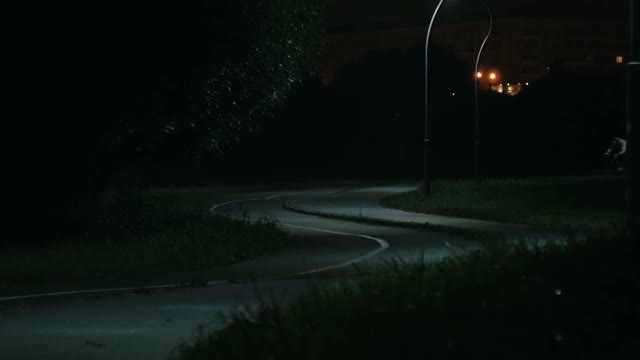 Cyclist Rides Through The Park