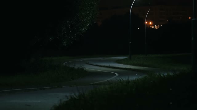 Cyclist Rides Through The Park