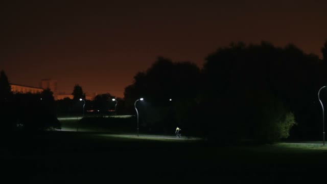 Cyclist Rides Through The Park