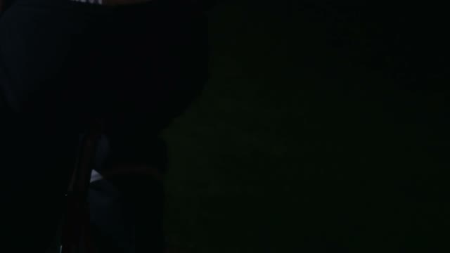 Cyclist Riding At Night Close-up