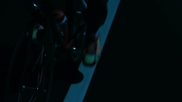 Cyclist Riding A Bicycle At Night Close-up