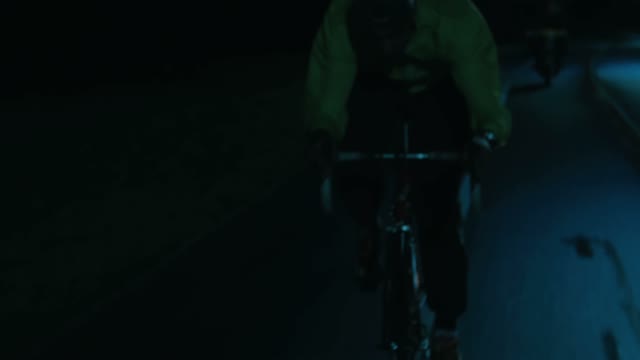 Cyclist Riding At Night Close-up