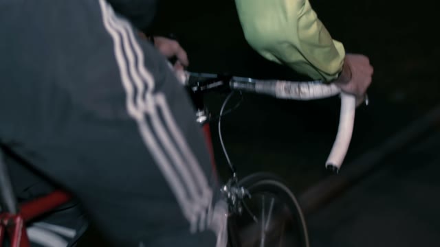 Cyclist Riding A Bicycle At Night Close-up