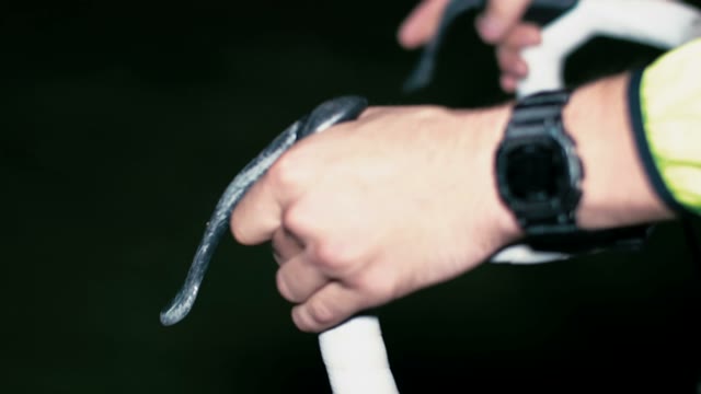 Cyclist Riding At Night Close-up
