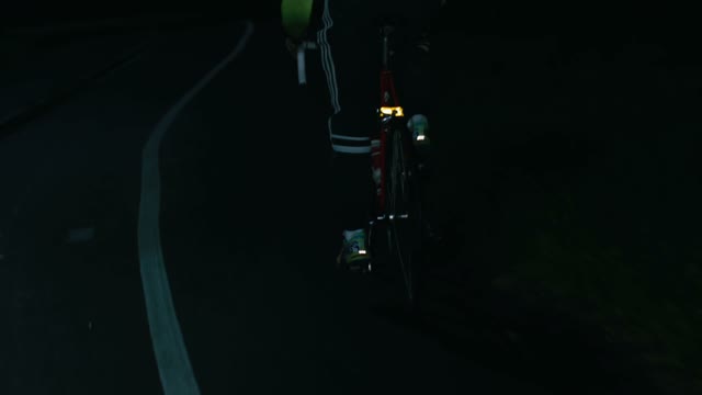 Cyclist Riding At Night Close-up