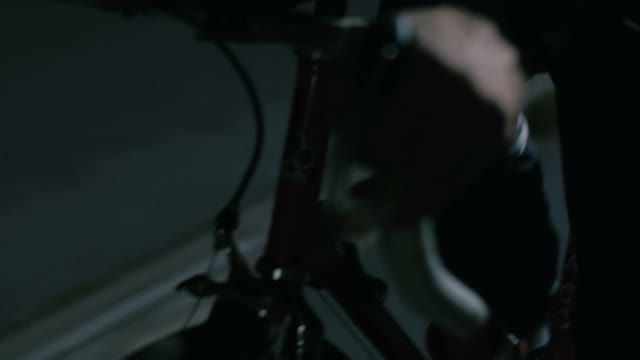 Cyclist Riding At Night Close-up