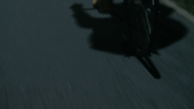 Cyclist Riding At Night Close-up