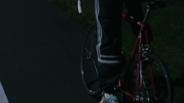Cyclist Riding At Night Close-up