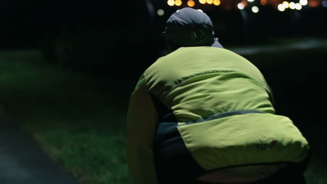 Cyclist Riding At Night Close-up
