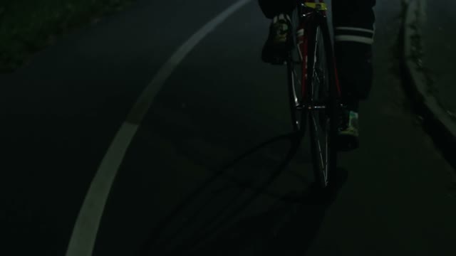 Cyclist Riding At Night Close-up