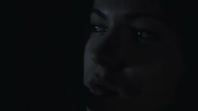 Girl Smokes In The Dark Close-up