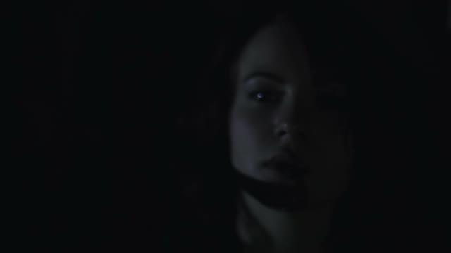 Girl Smokes In The Dark Close-up