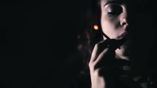 Girl Smokes A Cigarette Close-up