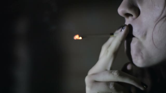 Girl Smokes A Cigarette Close-up