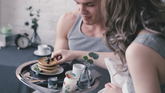 Girl Feeds A Guy With A Berry Close-up