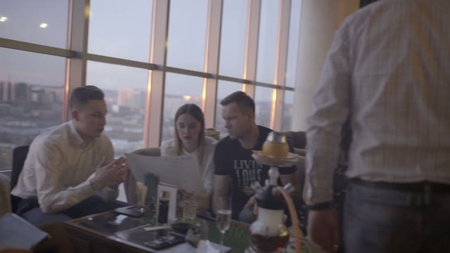Company Of Friends Communicate In A Bar