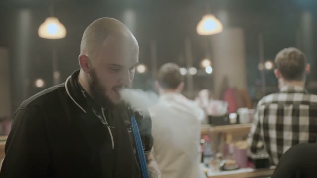 Man Is Preparing A Hookah For Smoking Close-up