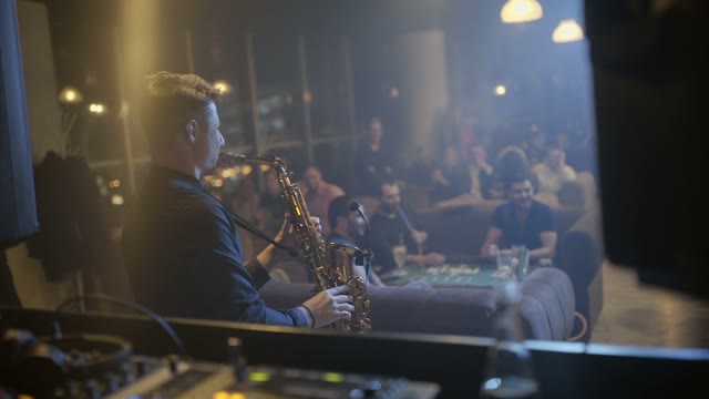 Man Is Playing A Saxophone Close-up