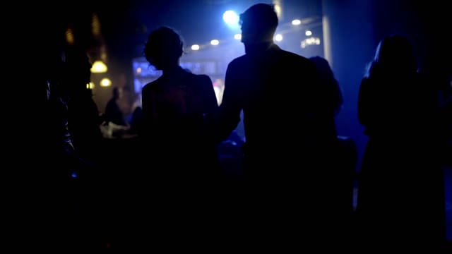 People Are Dancing In A Nightclub