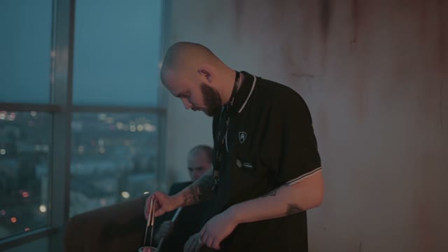 Hookahman Changes The Coals In The Hookah Close-up