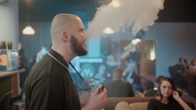 Man Is Preparing A Hookah For Smoking Close-up