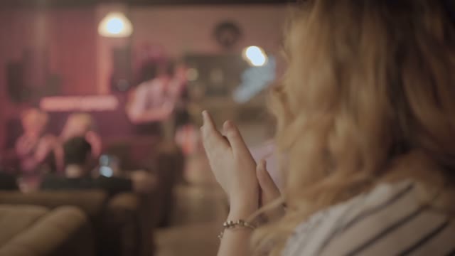 Girl Applauds To The Men Close-up