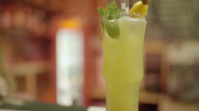 Hand Takes Cocktail Close-up
