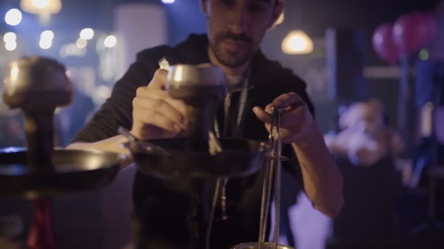 Man Is Preparing A Hookah For Smoking Close-up