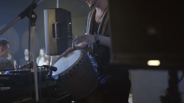 Man Playing With His Hands On A Drum Close-up