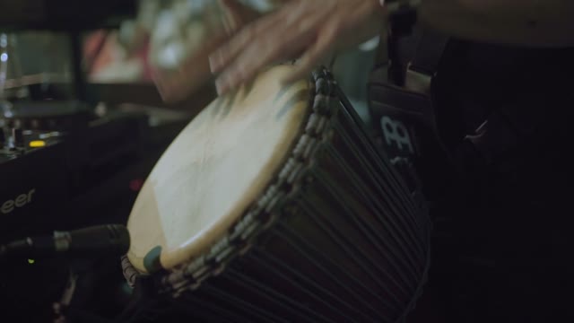 Man Playing With His Hands On A Drum Close-up