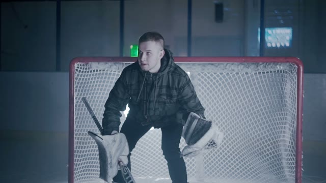 Man At The Gate Catches The Puck
