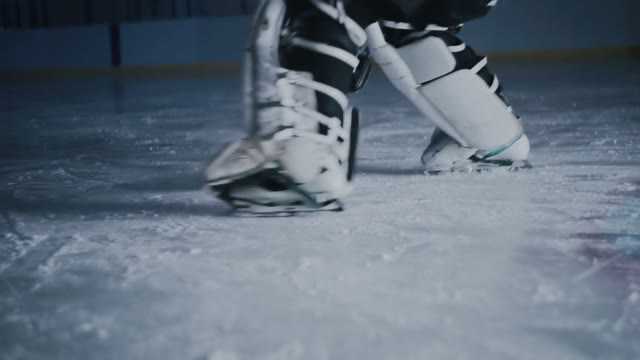 Hockey Player Scores A Goal In The Gate Close-up