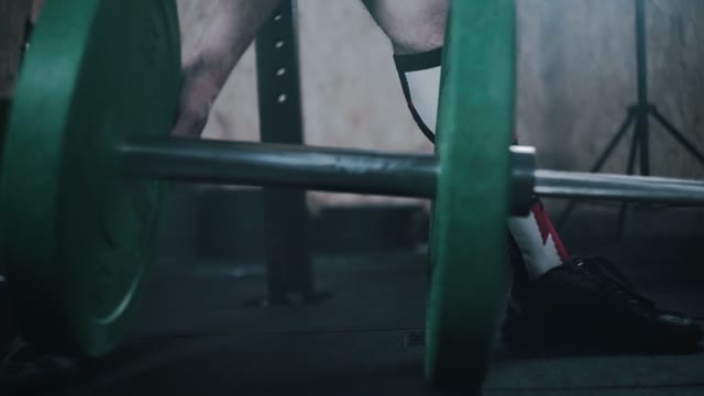 Sportsman Prepares The Barbell Close-up