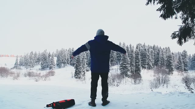 The Guy Enjoys The Beautiful Enchanting Winter Forest