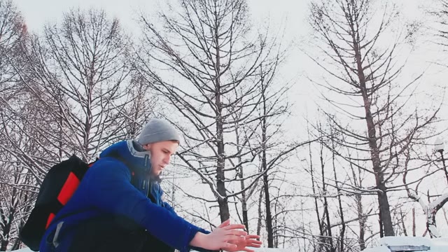 A Young Guy With A Good Physique Sits By The Fire