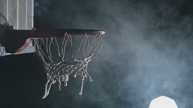 The Young Basketball Player Is Struggling To Throw The Ball Into The Ring
