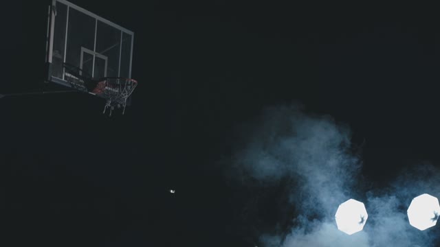 Basketball Player Trains In Throwing A Ball Into The Ring