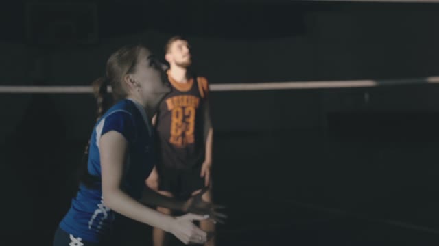 Girl With A Guy Playing Volleyball