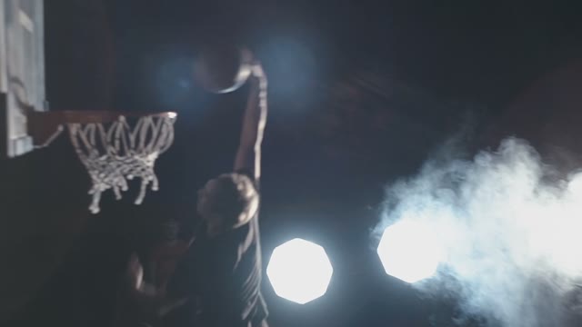 Cool Basketball Player Beautifully Throws The Ball Into The Ring