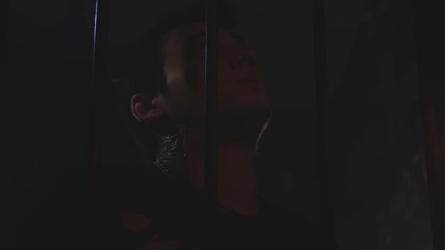 Mutilated And Exhausted Guy With All His Might Trying To Get Out Of The Locked
