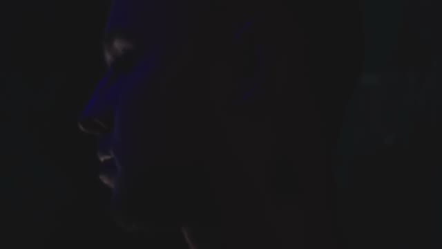 A Man Is Examined In A Dark Room
