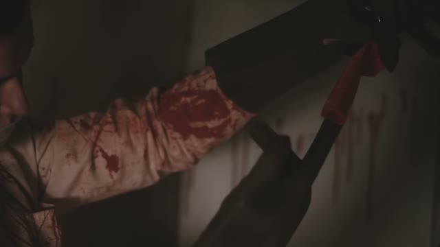 Crazy Doctor Maniac Holds The Remains Of A Man