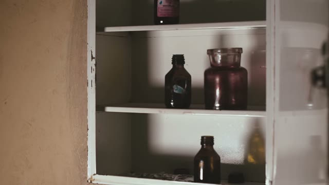 Bottles With Medical Preparations On Shelves