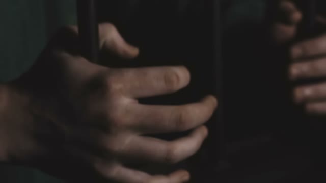 Men's Hands Hold On To The Door
