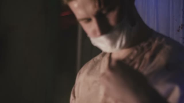 A Man With A Terrible Scar On His Forehead Performing A Surgical Operation